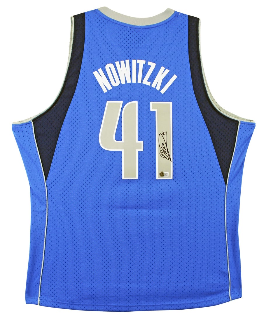 Dirk Nowitzki Signed Blue Mavericks Swingman Jersey BAS Certified: Dirk Nowitzki Signed Blue Mavericks Swingman Jersey BAS Certified This authentic Dallas Mavericks jersey features the signature of NBA star Dirk Nowitzki. Crafted by Mitchell & Ness, this blue 2010-11