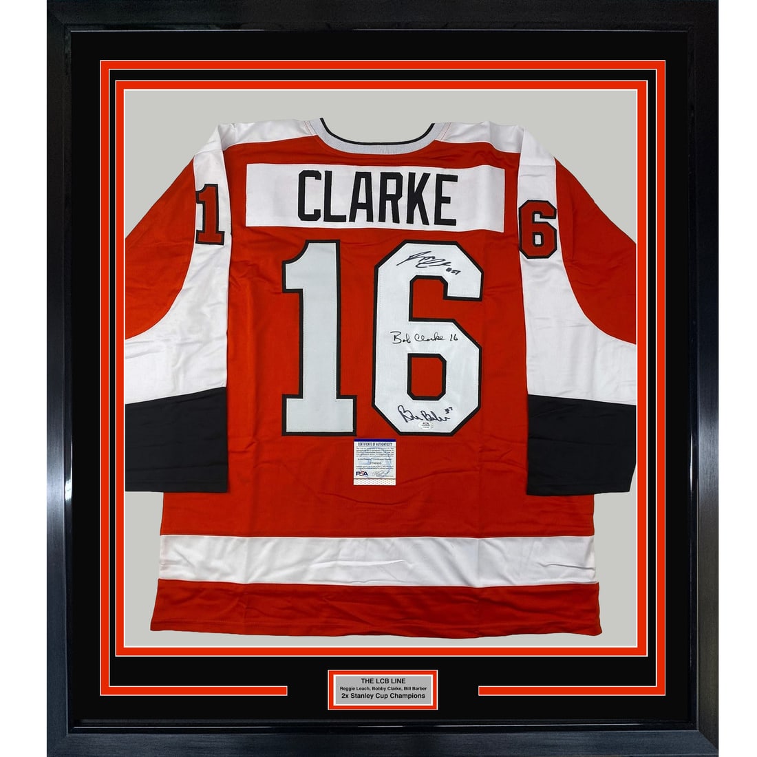 Framed Signed Jersey of Reggie Leach Bobby Clarke Bill Barber JSA COA 33x42: Framed Signed Jersey of Reggie Leach Bobby Clarke Bill Barber JSA COA 33x42 This framed autographed jersey features the signatures of NHL legends Reggie Leach, Bobby Clarke, and Bill Barber. The item 