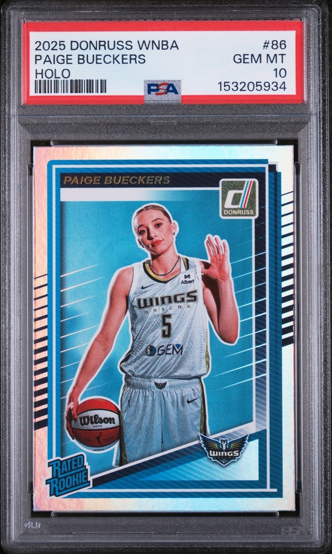 PSA 10 Paige Bueckers 2025 Panini Donruss #86 Holo RC: PSA 10 Paige Bueckers 2025 Panini Donruss #86 Holo RC Graded 2025 Panini Donruss Paige Bueckers #86 Holo Rookie RC sports trading card. This pre-owned card is encapsulated and graded by PSA, with a Ge