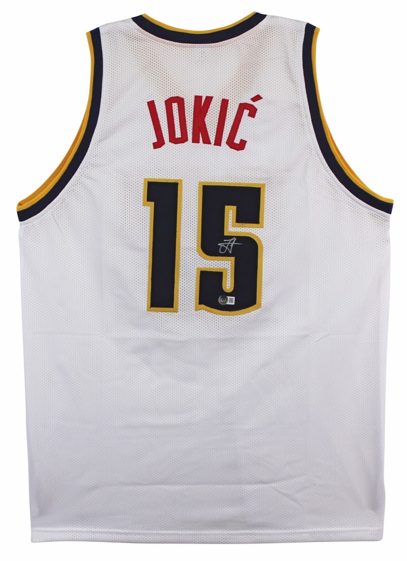 Nikola Jokic Signed White Jersey Beckett BAS Witnessed Denver Nuggets Autograph: Nikola Jokic Signed White Jersey Beckett BAS Witnessed Denver Nuggets Autograph This white pro style jersey has been personally signed by Nikola Jokic of the Denver Nuggets. Authenticated by Beckett A