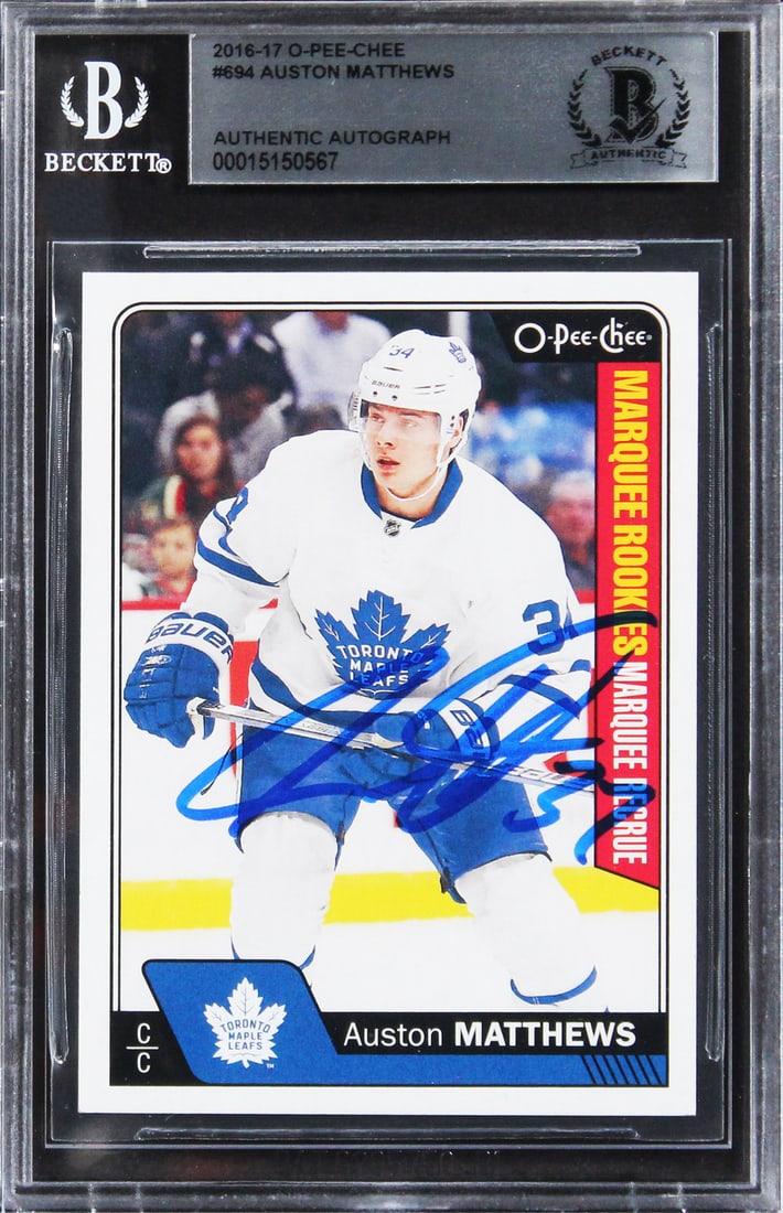 Auston Matthews Autographed 2016 O-Pee-Chee Rookie Card Beckett Authenticated: Auston Matthews Autographed 2016 O-Pee-Chee Rookie Card Beckett Authenticated This 2016 O-Pee-Chee #694 rookie card features Auston Matthews of the Toronto Maple Leafs. The card has been personally si