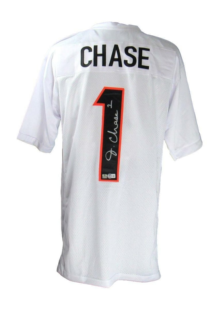 Beckett Authenticated Ja'Marr Chase Bengals Custom Football Jersey: Beckett Authenticated Ja'Marr Chase Bengals Custom Football Jersey Pre-owned custom Cincinnati Bengals football jersey signed by Ja'Marr Chase. This original autographed jersey is authenticated by Bec