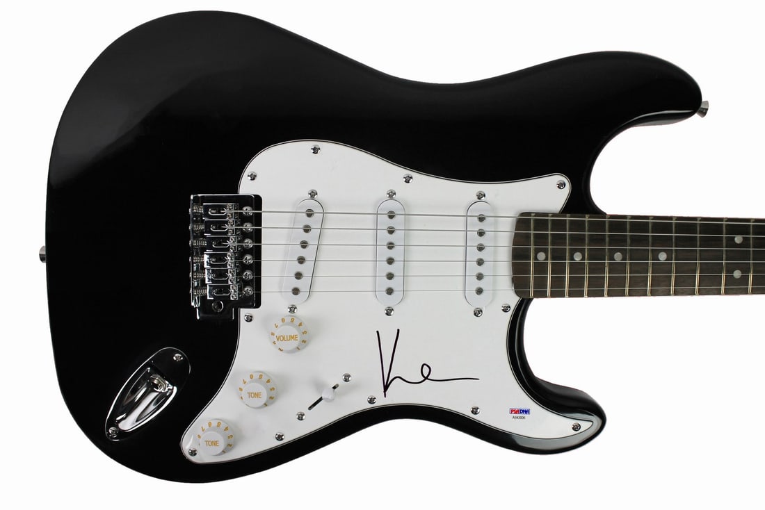 Signed Black Electric Guitar by Kevin Shield PSA DNA: Signed Black Electric Guitar by Kevin Shield PSA DNA This black electric guitar has been personally signed by Kevin Shield of My Bloody Valentine. The guitar is an original item and includes PSA/DNA a