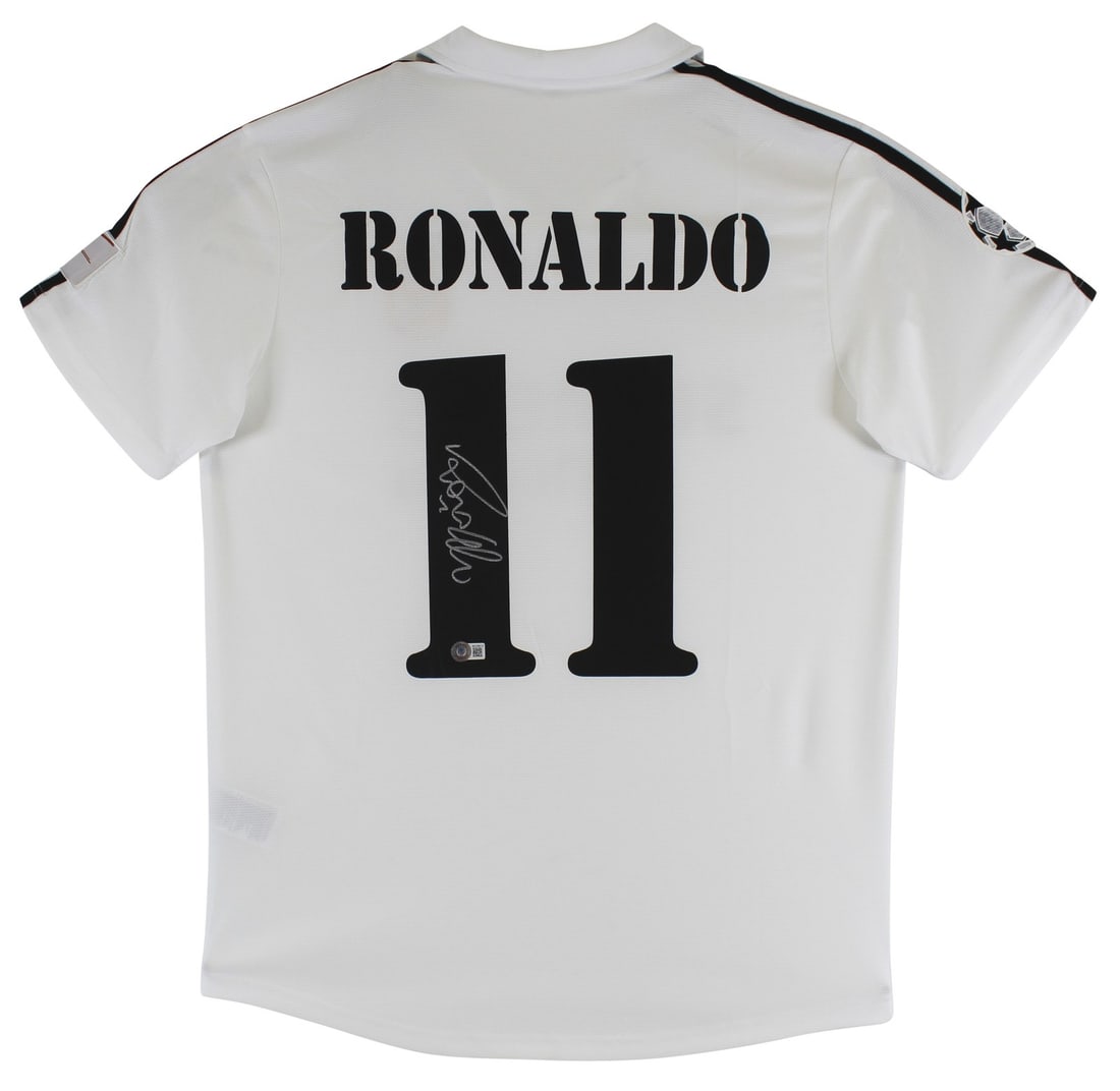 Beckett Authenticated Ronaldo Nazario Signed Real Madrid Centennial Jersey: Beckett Authenticated Ronaldo Nazario Signed Real Madrid Centennial Jersey Autographed white 1902-2002 Centennial jersey personally signed by Ronaldo Nazario of Real Madrid Football Club. The item is 