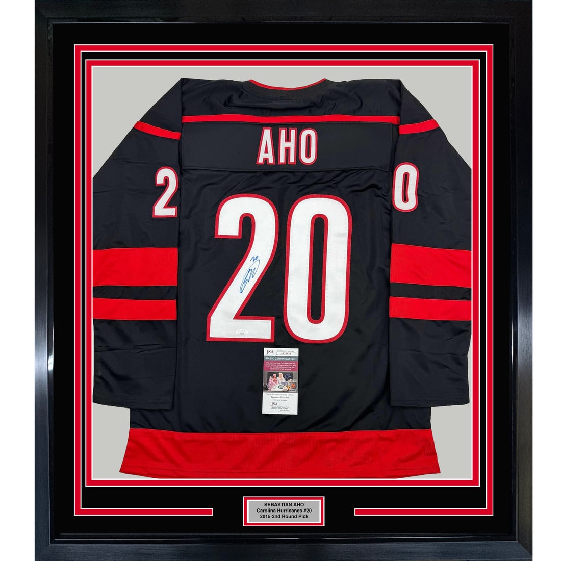 Sebastian Aho Signed Framed Carolina Hurricanes Jersey JSA 35x39: Sebastian Aho Signed Framed Carolina Hurricanes Jersey JSA 35x39 This professionally framed and matted Carolina Hurricanes black jersey features the authentic signature of NHL player Sebastian Aho. Th