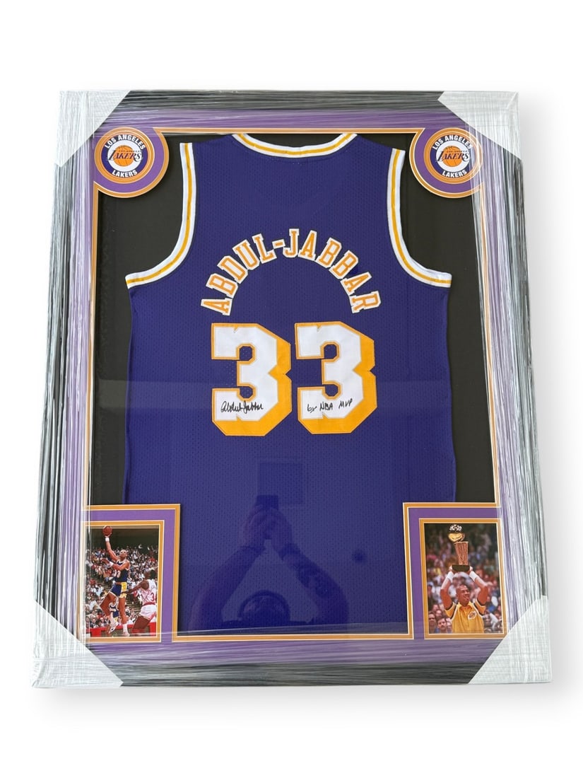 Framed Lakers jersey signed by Kareem Abdul-Jabbar 6x NBA MVP: Framed Lakers jersey signed by Kareem Abdul-Jabbar 6x NBA MVP This framed Los Angeles Lakers jersey is autographed by Kareem Abdul-Jabbar and features the inscription "6x NBA MVP." The jersey is prese