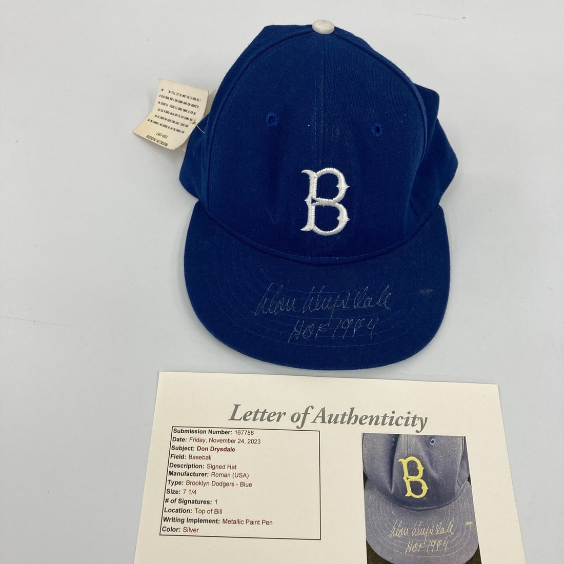 Don Drysdale Signed Brooklyn Dodgers Hat HOF 1984 JSA COA: Don Drysdale Signed Brooklyn Dodgers Hat HOF 1984 JSA COA This is a pre-owned Brooklyn Dodgers game model baseball hat signed by legendary pitcher Don Drysdale, who was inducted into the Hall of Fame 