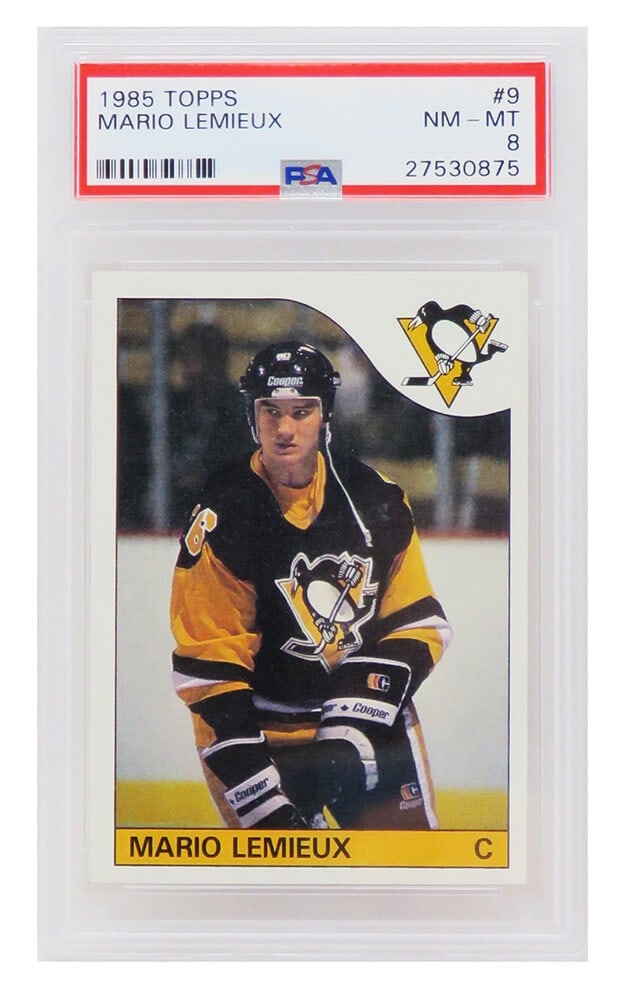 1985 Topps Mario Lemieux Rookie Card #9 PSA 8 NM-MT: 1985 Topps Mario Lemieux Rookie Card #9 PSA 8 NM-MT This is a 1985 Topps rookie trading card of Mario Lemieux, a legendary player for the Pittsburgh Penguins. The card features a grade of NM-MT (Near 