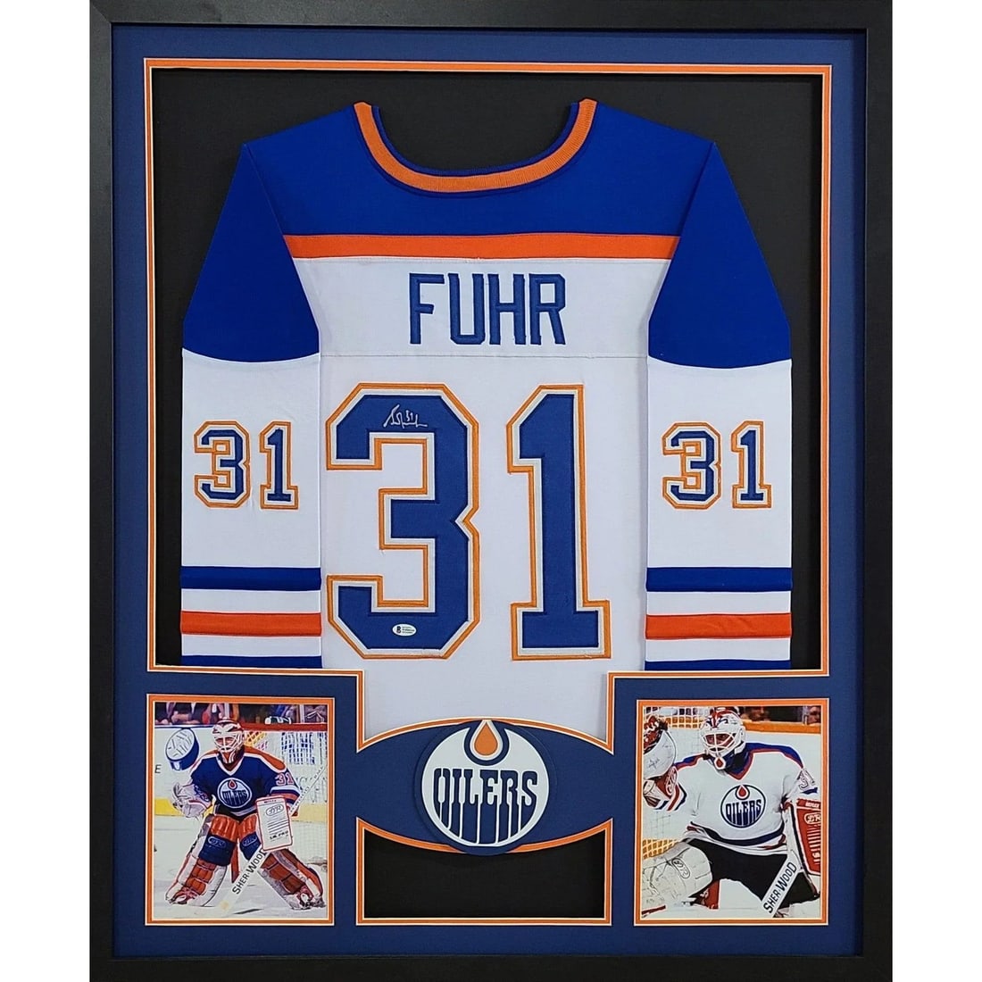 Grant Fuhr Signed Framed Jersey Edmonton Oilers Beckett Authenticated: Grant Fuhr Signed Framed Jersey Edmonton Oilers Beckett Authenticated This is a framed jersey of Grant Fuhr, featuring his autograph. The jersey is authenticated by Beckett, a reputable name in sports