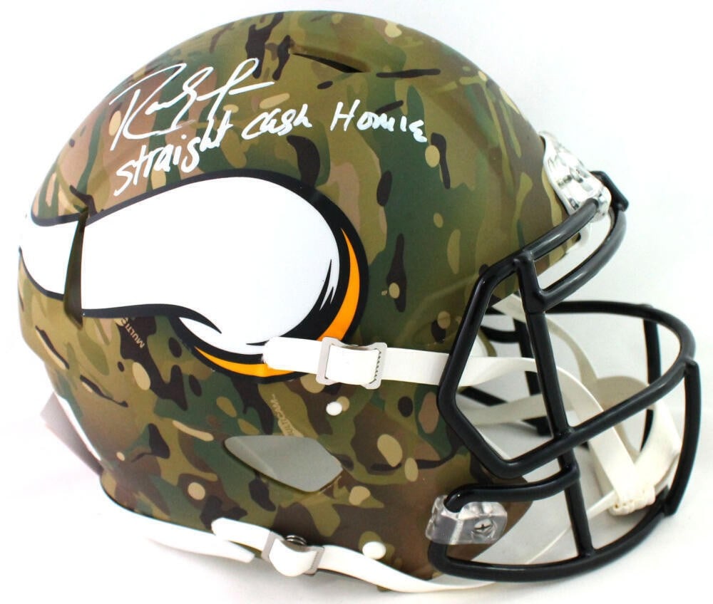 Minnesota Vikings full size camo helmet signed by Randy Moss Beckett authenticated: Minnesota Vikings full size camo helmet signed by Randy Moss Beckett authenticated This authentic Minnesota Vikings full-size camouflage helmet is signed by Randy Moss and includes an inscription. It 