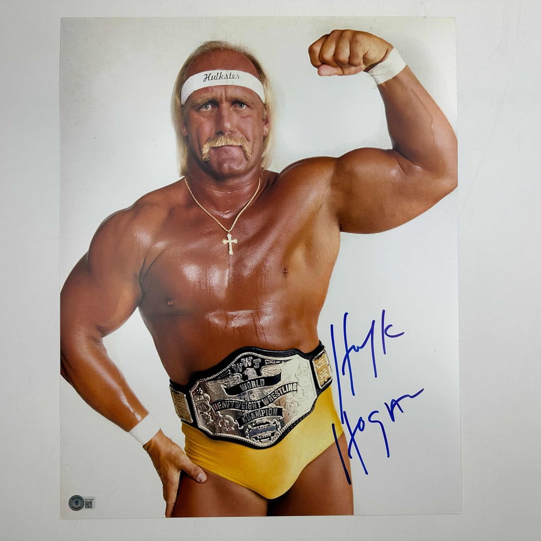 Hulk Hogan Autographed 16x20 WWE Photo Beckett BAS COA #5: Hulk Hogan Autographed 16x20 WWE Photo Beckett BAS COA #5 This is an autographed 16x20 photo of Hulk Hogan, showcasing the iconic Hulkamania theme from his WWE days. It is authenticated by Beckett Gra