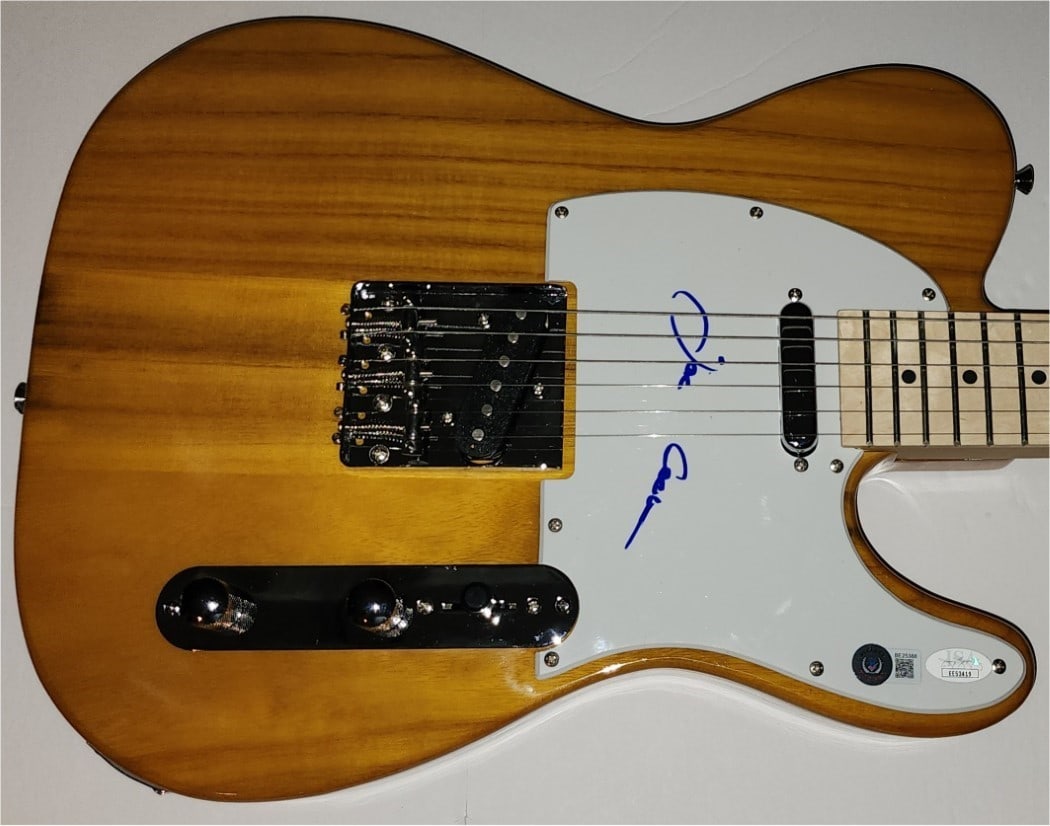Joe Cocker Autographed Electric Guitar with JSA Authentication: Joe Cocker Autographed Electric Guitar with JSA Authentication This authentic electric guitar is signed by the legendary musician Joe Cocker, known for his iconic song "Up Where We Belong." The guitar