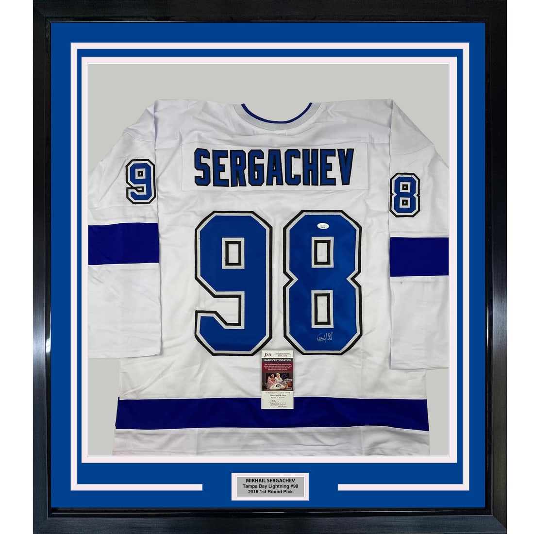Mikhail Sergachev Signed Framed Tampa Bay Lightning White Jersey JSA: Mikhail Sergachev Signed Framed Tampa Bay Lightning White Jersey JSA Professionally framed and matted autographed Mikhail Sergachev Tampa Bay white jersey display. This original signed piece includes 