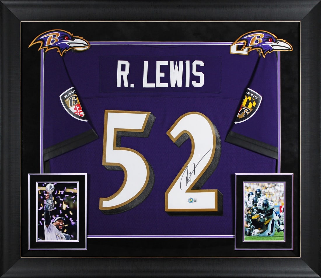 Ray Lewis Autographed Framed Purple Jersey Mitchell and Ness Beckett BAS Witnessed: Ray Lewis Autographed Framed Purple Jersey Mitchell and Ness Beckett BAS Witnessed This autographed purple Mitchell & Ness framed jersey features the signature of Ray Lewis from the Baltimore Ravens. 