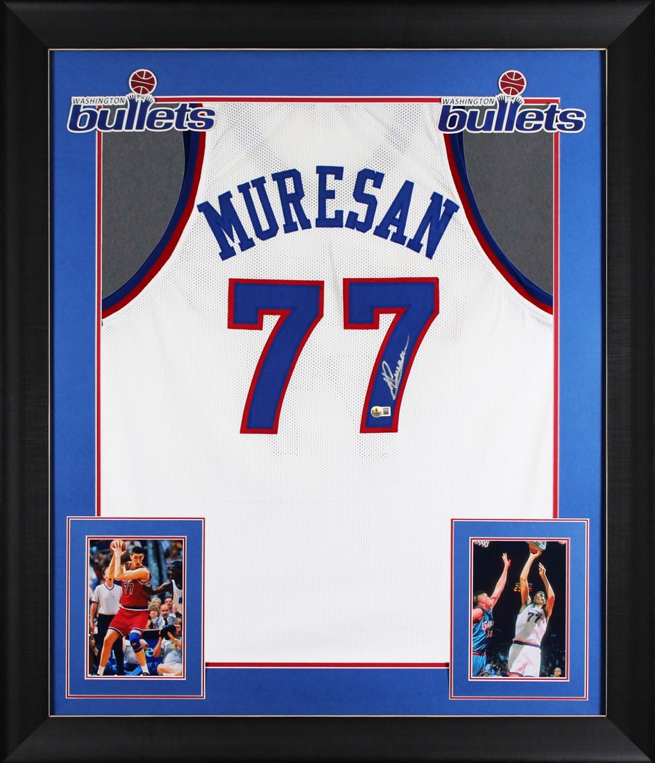 Framed White Jersey Signed by Gheorghe Muresan Beckett BAS Witnessed: Framed White Jersey Signed by Gheorghe Muresan Beckett BAS Witnessed This autographed white pro style framed jersey has been personally signed by Gheorghe Muresan of the Washington Bullets. It is an o