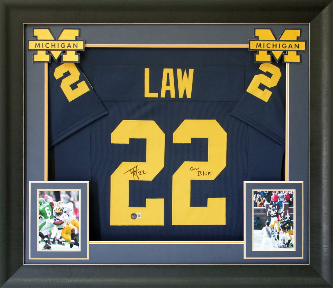 Ty Law Signed Navy Blue Framed Jersey Go Blue BAS Authenticated: Ty Law Signed Navy Blue Framed Jersey Go Blue BAS Authenticated Celebrate your love for Michigan football with this autographed Navy Blue Pro Style Framed Jersey, personally signed by legendary player