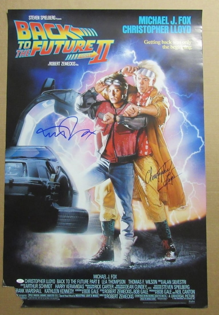 Michael J Fox Christopher Lloyd 27x40 Signed Poster Back to the Future II JSA: Michael J Fox Christopher Lloyd 27x40 Signed Poster Back to the Future II JSA Enhance your collection with this original autographed poster from the iconic film "Back to the Future II." Measuring 27x4