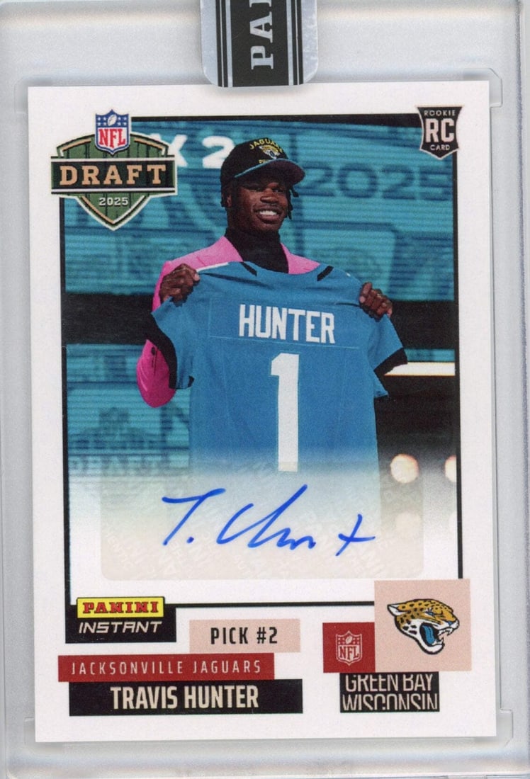 2025 Panini Instant NFL Travis Hunter #DN2 Autographed Rookie Card: 2025 Panini Instant NFL Travis Hunter #DN2 Autographed Rookie Card This is a 2025 Panini Instant NFL Travis Hunter #DN2 Draft Night Autographed Rookie Football Card. The card features the signature of