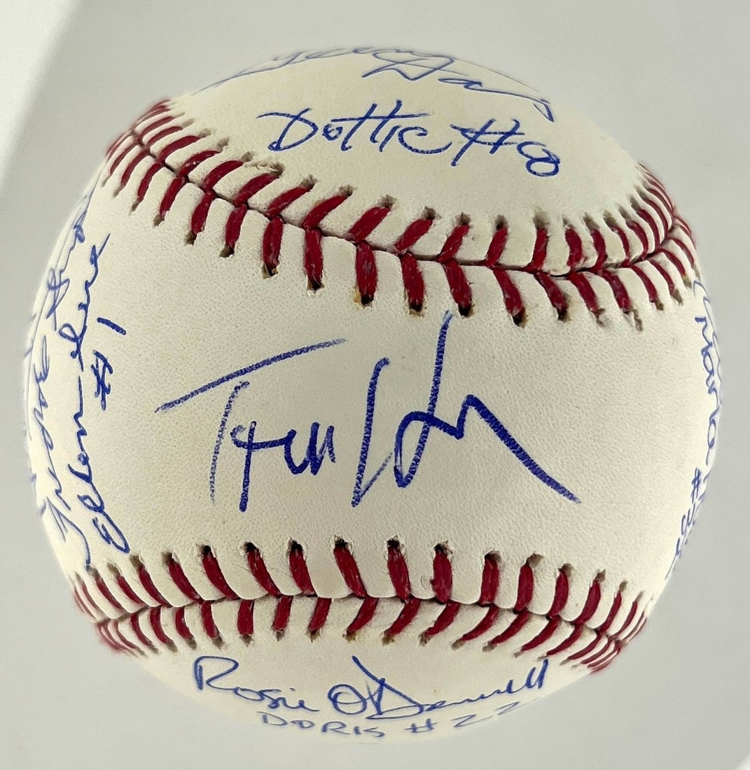 15-Signature A League of Their Own Cast Baseball Tom Hanks JSA: 15-Signature A League of Their Own Cast Baseball Tom Hanks JSA This is an original baseball signed by 15 cast members from A League of Their Own, including Tom Hanks, Geena Davis, Patty Pelton, Megan 
