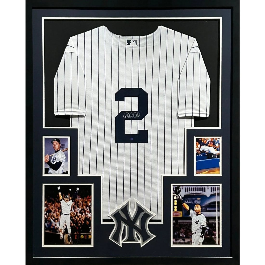 Framed Derek Jeter Autographed Yankees Jersey with JSA Authentication: Framed Derek Jeter Autographed Yankees Jersey with JSA Authentication This framed New York Yankees jersey is autographed by Derek Jeter and features authentication by JSA. The display includes UV-prot