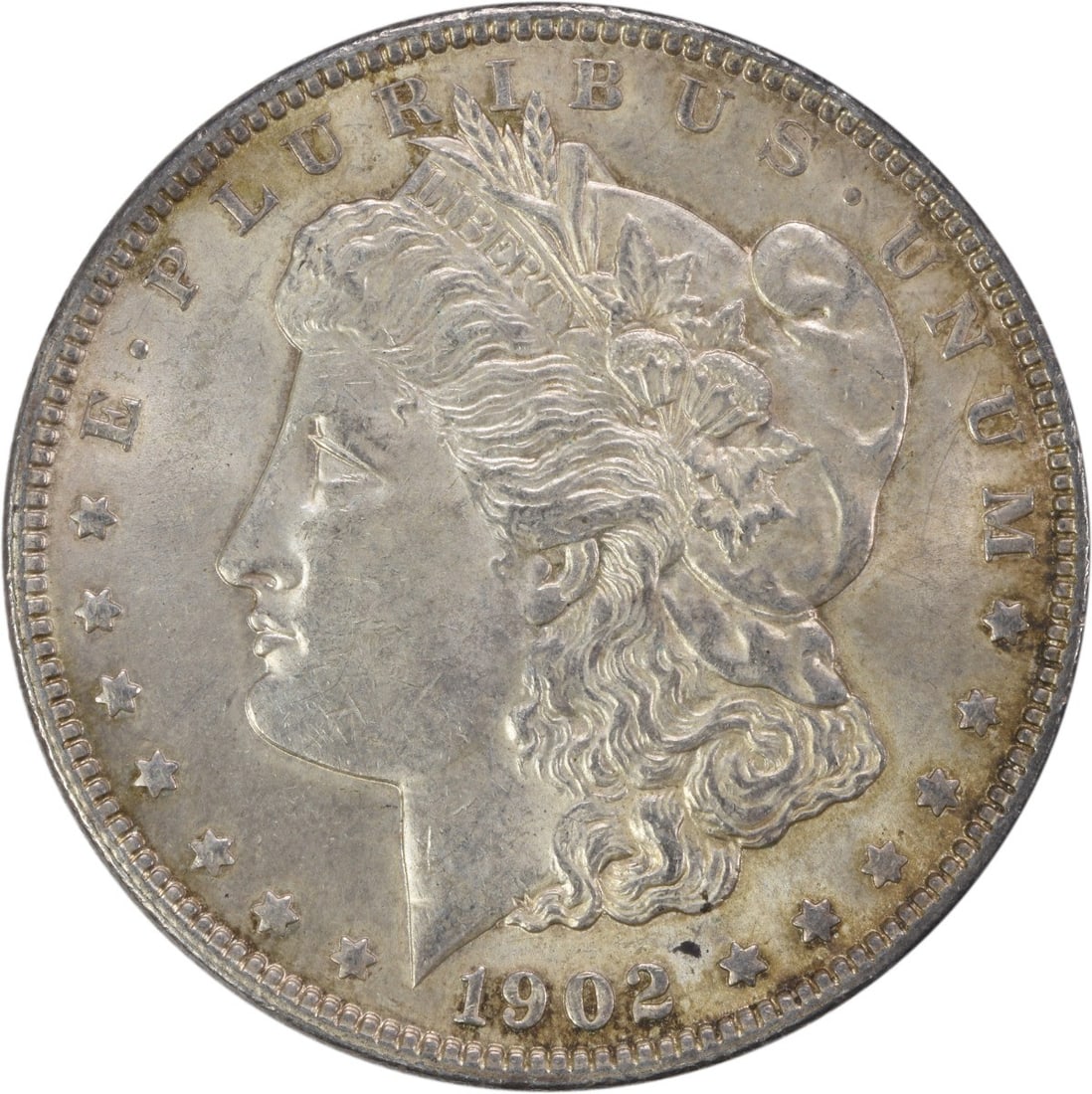 1902 United States Morgan Dollar 90 Percent Silver AU Uncertified Coin: 1902 United States Morgan Dollar 90 Percent Silver AU Uncertified Coin This 1902 Morgan Silver Dollar is an AU (About Uncirculated) slider coin, featuring a composition of 90% silver and 10% copper. M