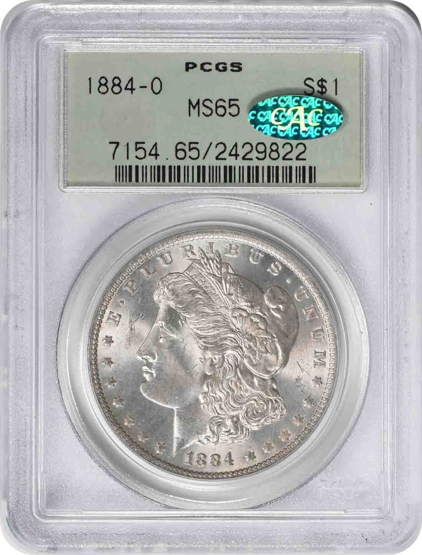 1884 New Orleans Morgan Dollar PCGS MS65 CAC OGH: 1884 New Orleans Morgan Dollar PCGS MS65 CAC OGH This 1884-O Morgan Silver Dollar has been graded MS65 by PCGS and is housed in an Old Green Holder (OGH). The coin features the design by George T. Mor