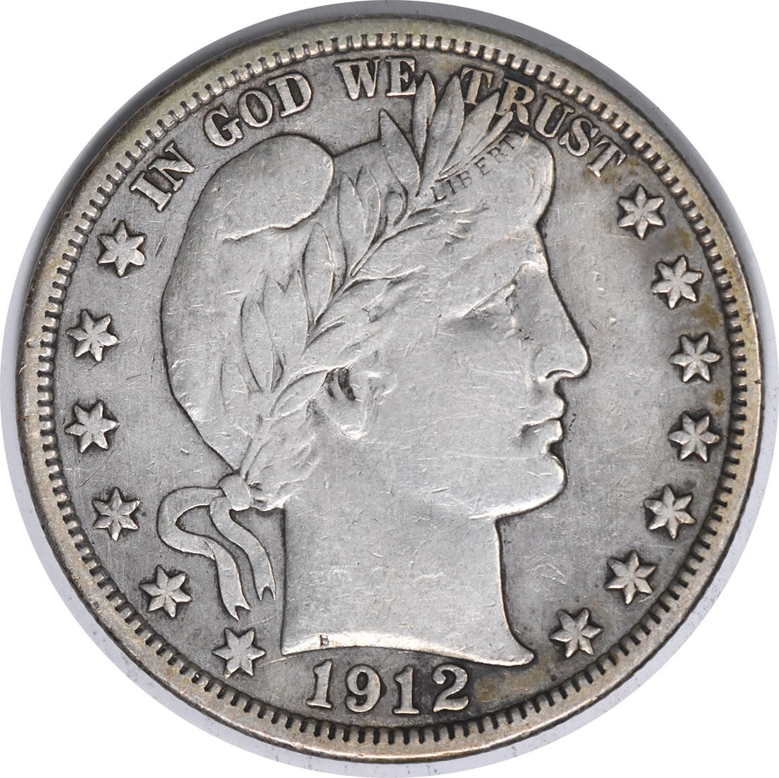 1912 United States Barber 50C Silver Half Dollar VF Uncertified: 1912 United States Barber 50C Silver Half Dollar VF Uncertified 1912 Barber silver half dollar in VF grade. This circulated, uncertified United States coin is a pre-owned example of the 50C Barber iss