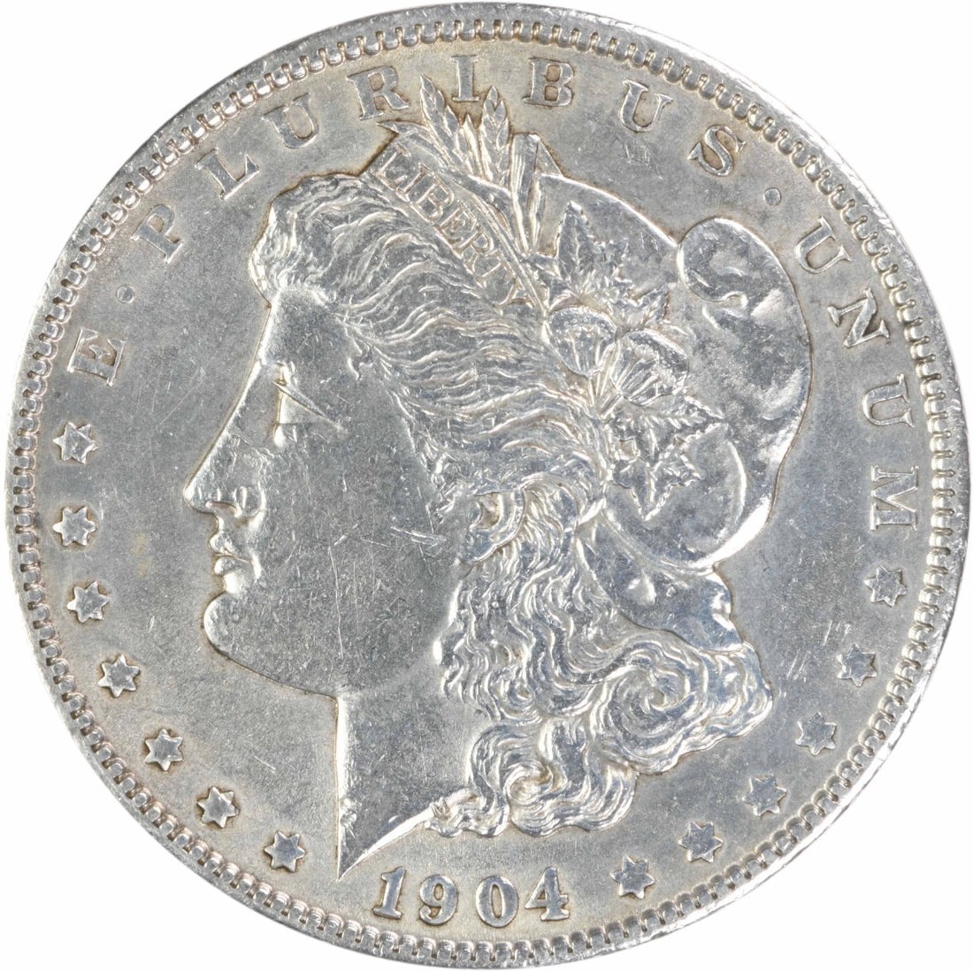 AU 1904 Philadelphia Morgan Silver Dollar Uncertified: AU 1904 Philadelphia Morgan Silver Dollar Uncertified 1904 Morgan Silver Dollar in AU circulated condition. This pre-owned coin is an uncertified example of the classic Morgan dollar series and featur