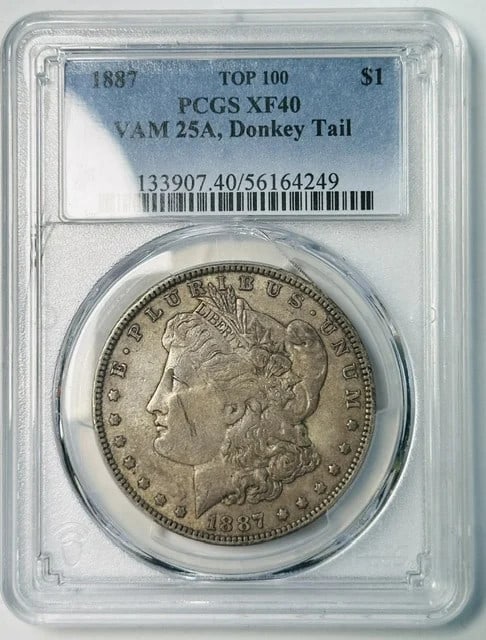 PCGS XF-40 1887 Morgan Silver Dollar VAM 25A Donkey Tail: PCGS XF-40 1887 Morgan Silver Dollar VAM 25A Donkey Tail 1887 Morgan Silver Dollar certified by PCGS as XF-40. This silver dollar is the VAM 25A Donkey Tail variety, also noted as a Top 100 variety. P