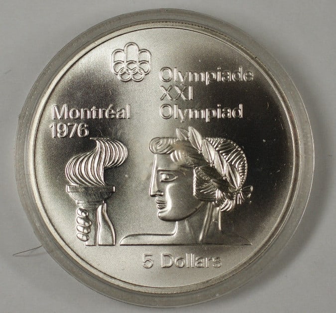 Canada 1974 $5 Sterling Silver Montreal Olympics Torch Coin: Canada 1974 $5 Sterling Silver Montreal Olympics Torch Coin This 1974 Canada RCM $5 silver coin commemorates the 1976 Montreal Olympic Games. Struck in sterling silver with a fineness of 0.925, the co