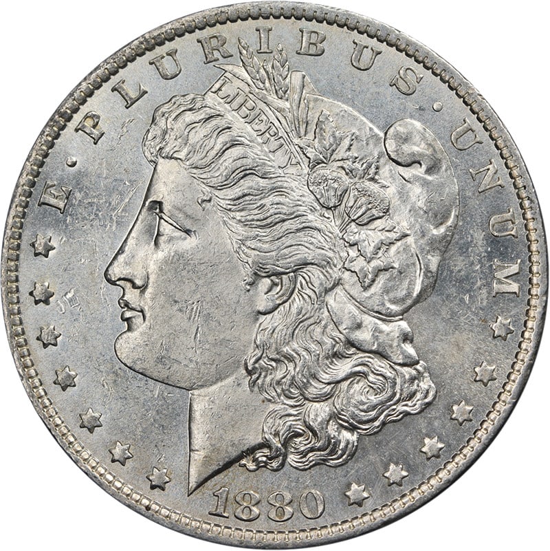 1880 O Morgan Dollar Silver AU BU Strong Strike: 1880 O Morgan Dollar Silver AU BU Strong Strike This 1880-O Morgan Silver Dollar features attractive eye appeal, strong luster, and a well-defined strike. The coin displays nice color and surfaces, wi
