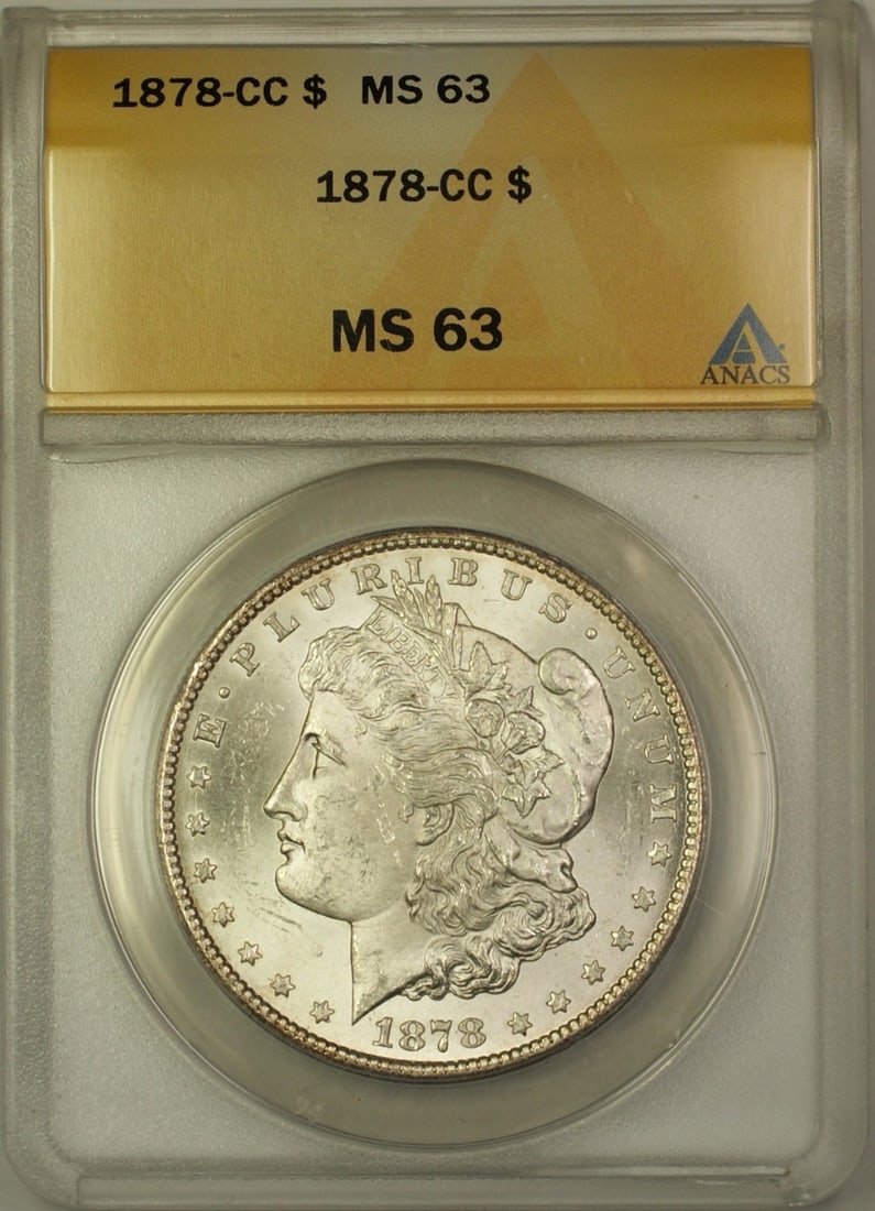 ANACS MS 63 Carson City 1878-CC Morgan Silver Dollar One Dollar Coin: ANACS MS 63 Carson City 1878-CC Morgan Silver Dollar One Dollar Coin This is an 1878-CC Morgan Silver Dollar $1 coin graded MS-63 by ANACS. Minted in Carson City, this uncirculated coin is composed of