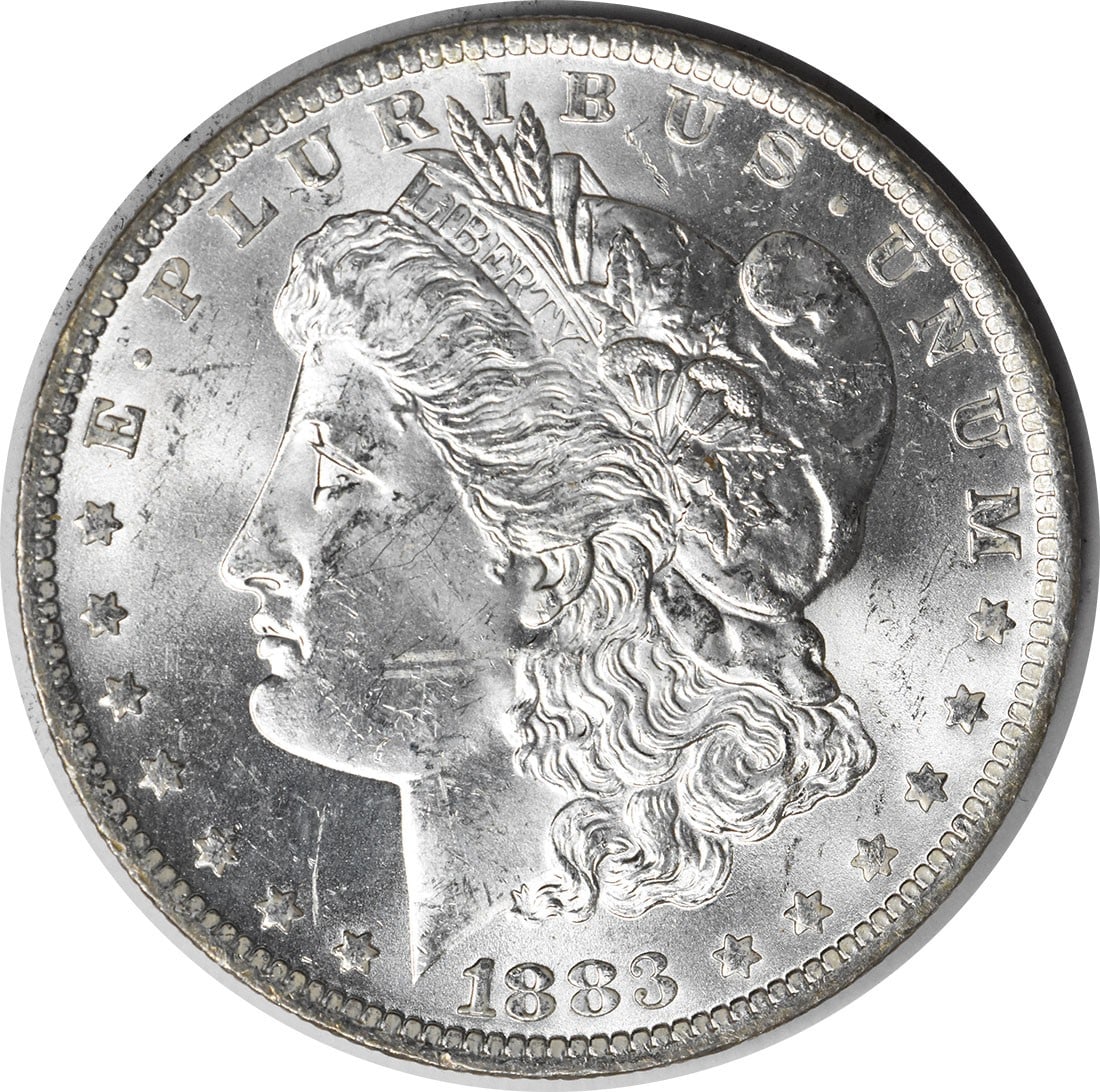 Choice BU 1883-O Silver Morgan Dollar with Attractive Toning Uncertified: Choice BU 1883-O Silver Morgan Dollar with Attractive Toning Uncertified This 1883-O Morgan Silver Dollar is a Choice Brilliant Uncirculated coin with attractive toning. It remains uncertified and is 