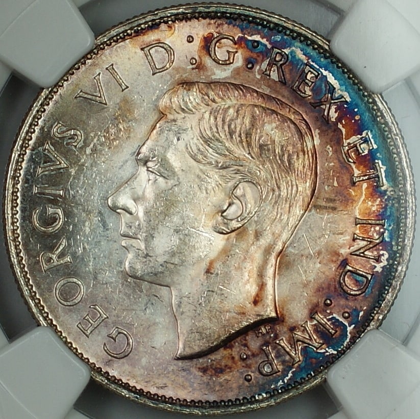 Canada 1942 50C NGC MS-61 Toned Silver Half Dollar: Canada 1942 50C NGC MS-61 Toned Silver Half Dollar This 1942 Canada 50-cent half dollar is composed of 80% silver and has been graded MS-61 by NGC. The coin is uncirculated and features attractive ton