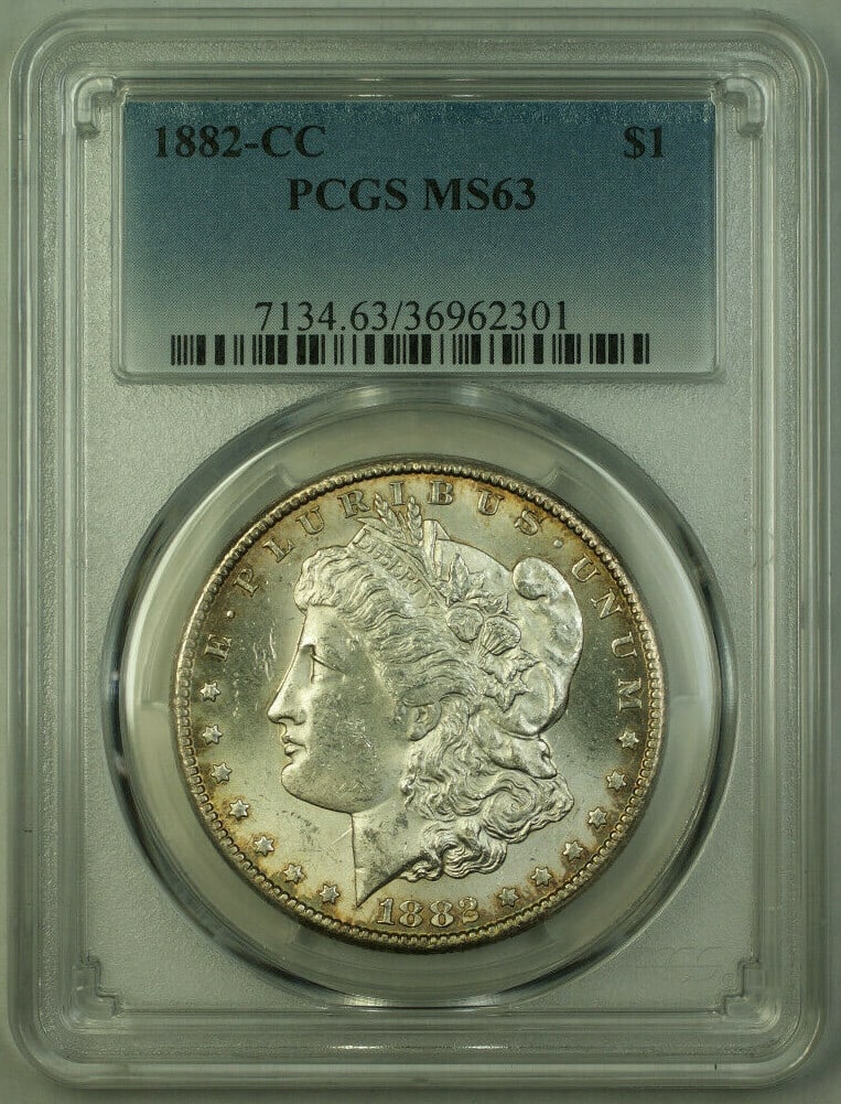 PCGS MS63 1882 CC Morgan Dollar Carson City Silver: PCGS MS63 1882 CC Morgan Dollar Carson City Silver This 1882-CC Morgan Silver Dollar is an uncirculated coin graded MS-63 by PCGS. It features a lightly toned finish and was minted in Carson City. The