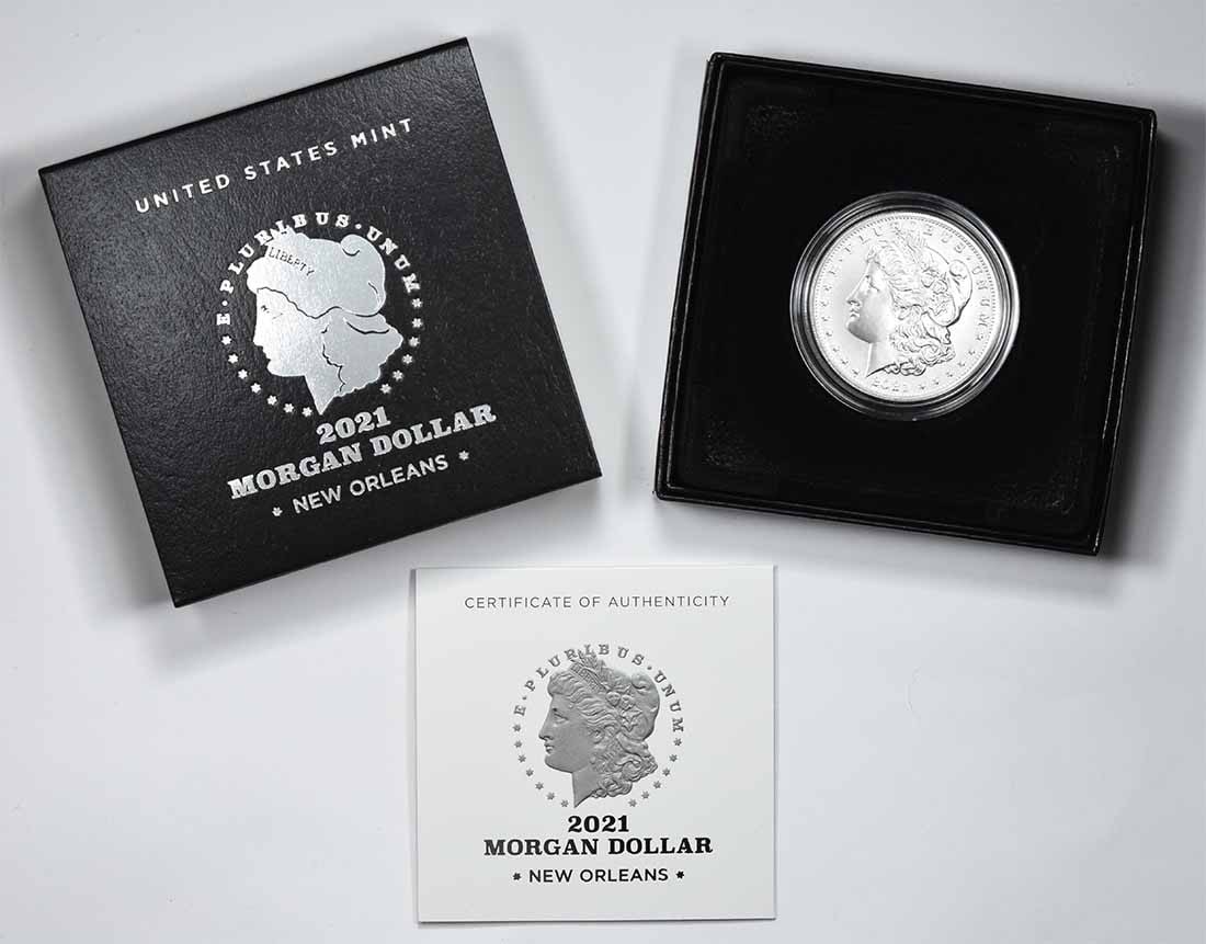 2021 O Privy Morgan Dollar Original Government Packaging: 2021 O Privy Morgan Dollar Original Government Packaging This 2021 O Privy Morgan Silver Dollar is presented in its original government packaging. Struck in 99.9% silver, this uncirculated coin featur
