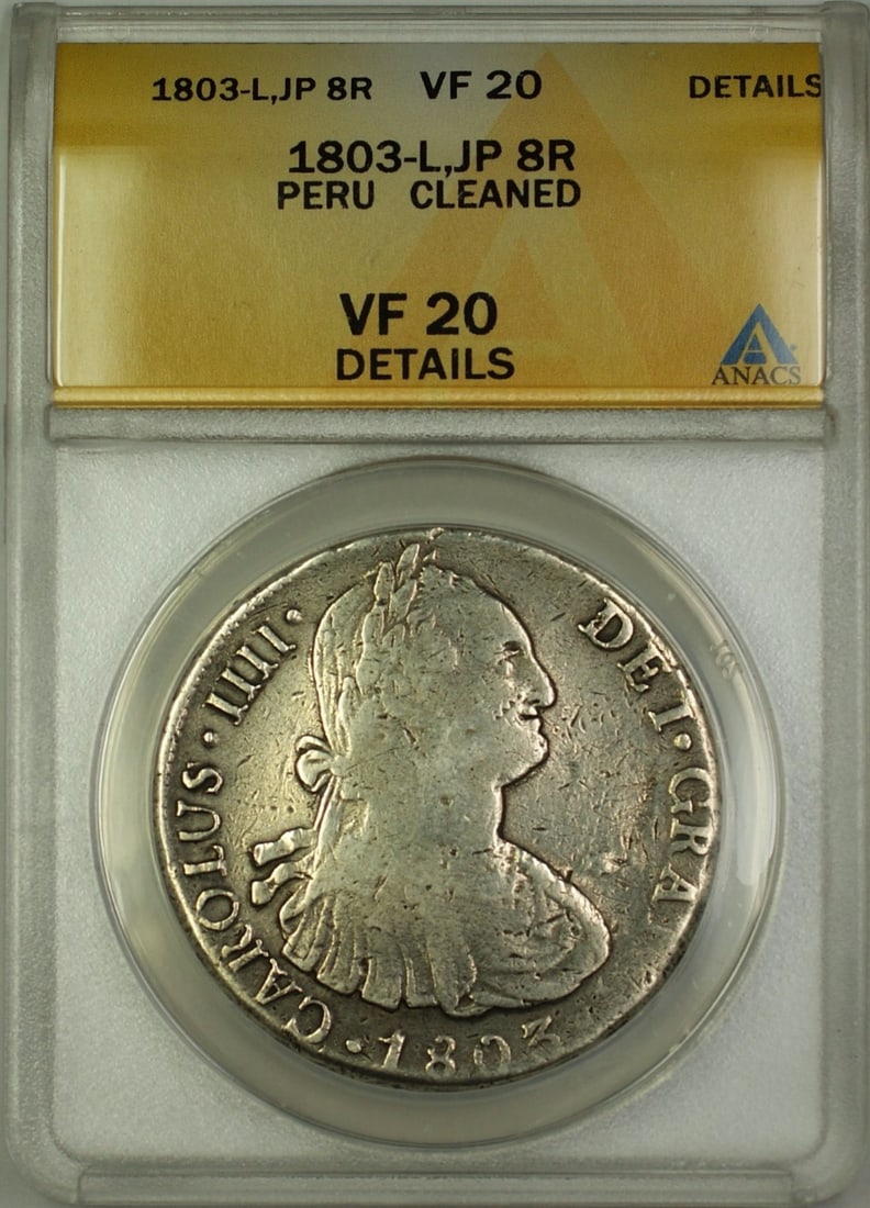 Peru 1803 8 Reales Silver Coin ANACS VF-20 Details Cleaned: Peru 1803 8 Reales Silver Coin ANACS VF-20 Details Cleaned This 1803-L JP Peru 8 Reales silver coin is graded ANACS VF-20 Details, with a noted cleaned condition. Minted in Peru, the coin is composed 