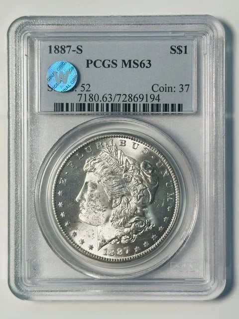 PCGS MS-63 1887-S Morgan Silver Dollar Sight White: PCGS MS-63 1887-S Morgan Silver Dollar Sight White 1887-S Morgan Silver Dollar certified by PCGS and graded MS-63. This pre-owned coin is composed of silver and is described as Sight White. Specificat