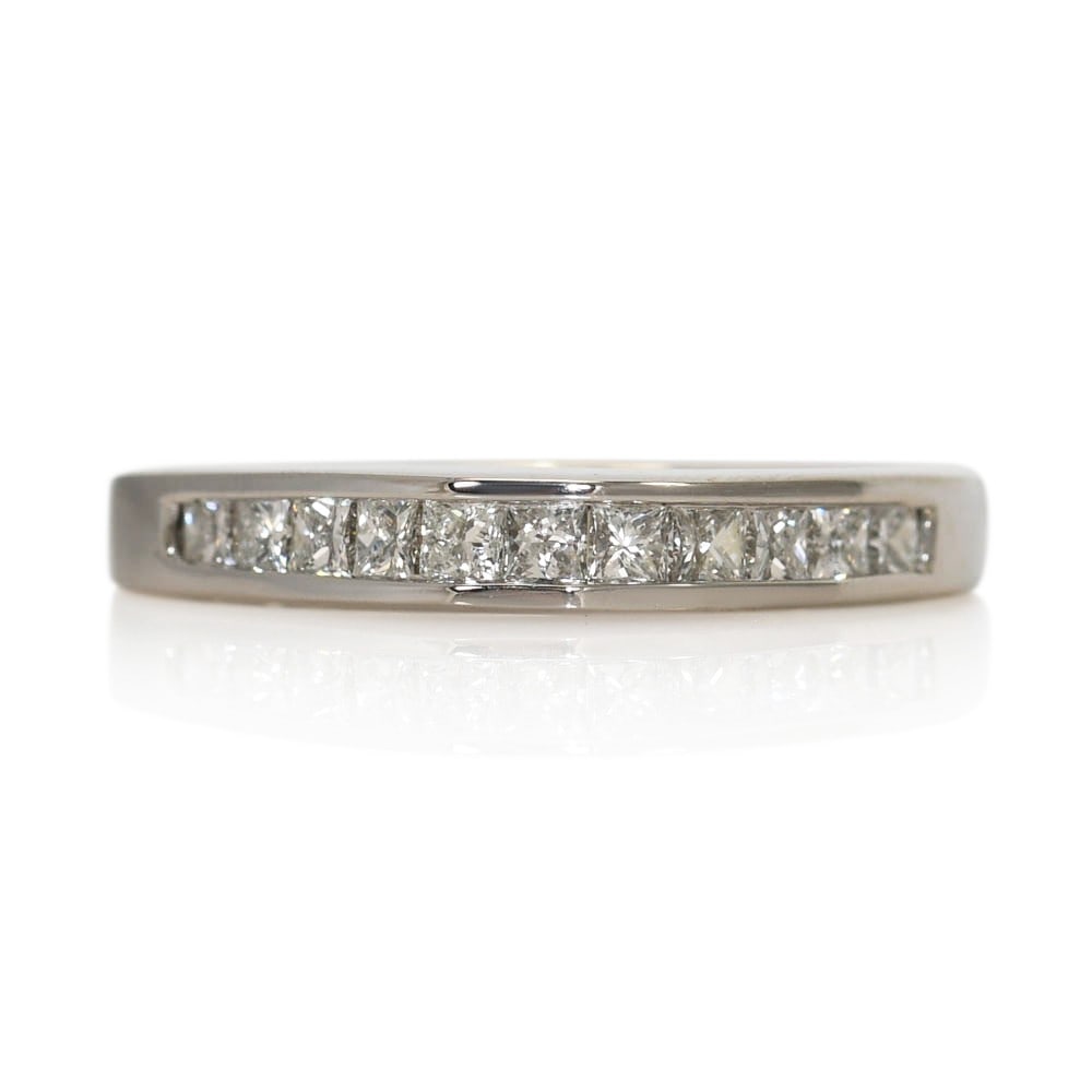 Unbranded 14K White Gold Wedding Band Ring with 11 Princess Cut Diamonds: Unbranded 14K White Gold Wedding Band Ring with 11 Princess Cut Diamonds Pre-owned unbranded wedding and anniversary band in 14k white gold, set with 11 natural princess-cut diamonds in a channel sett
