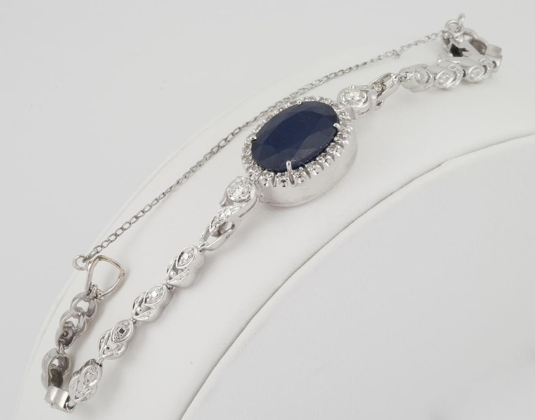 Art Deco 14k White Gold Bracelet with 8.00ct Sapphire and 0.75ct Diamonds: Art Deco 14k White Gold Bracelet with 8.00ct Sapphire and 0.75ct Diamonds Vintage Art Deco bracelet crafted in 14k white gold and set with a dark blue sapphire and diamond accents. This converted watc