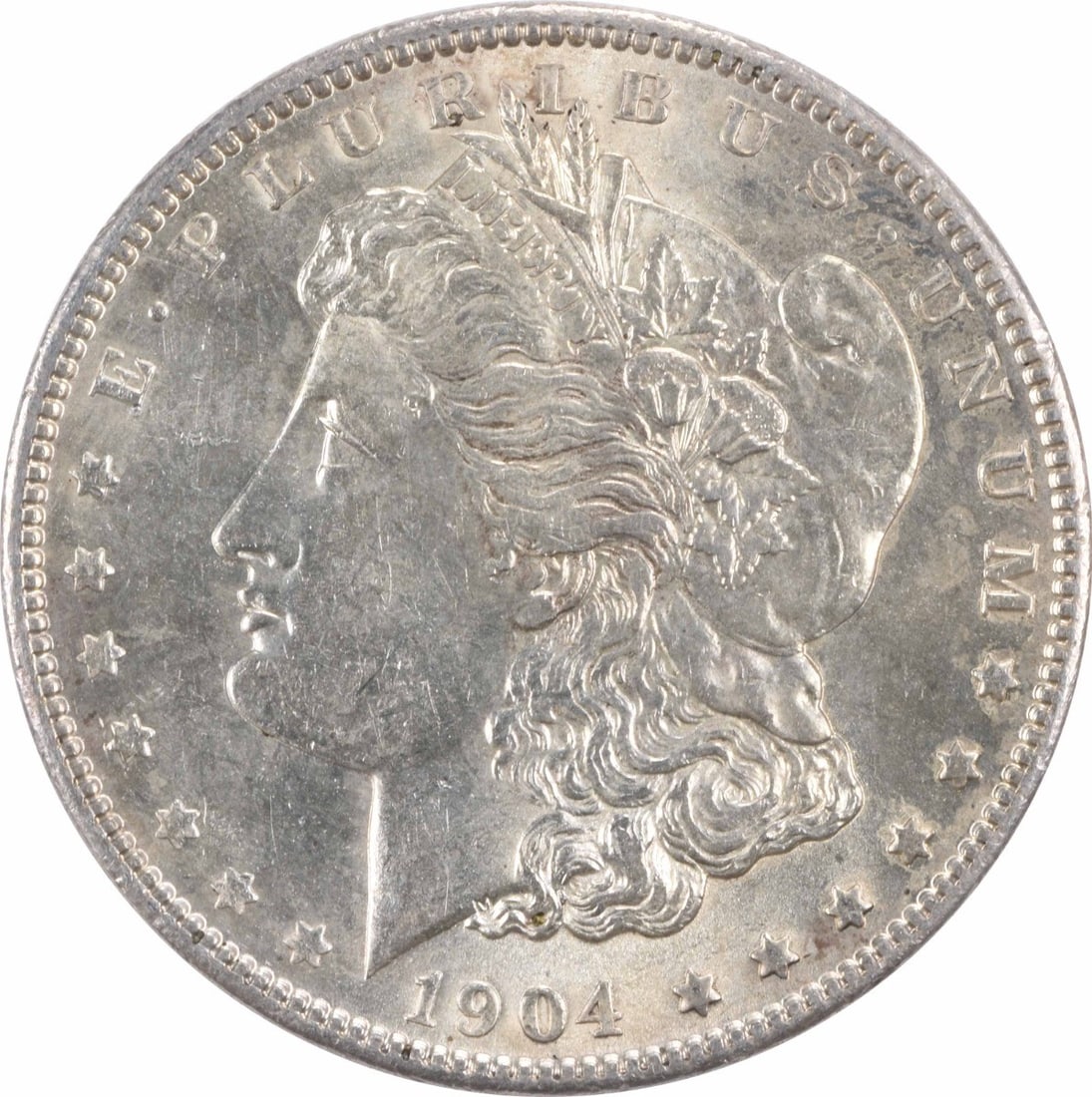 Brilliant Uncirculated 1904 Morgan Silver Dollar Uncertified No Mint Mark: Brilliant Uncirculated 1904 Morgan Silver Dollar Uncertified No Mint Mark This 1904 Morgan Silver Dollar is an uncirculated coin in Brilliant Uncirculated (BU) condition. Composed of silver, it featur