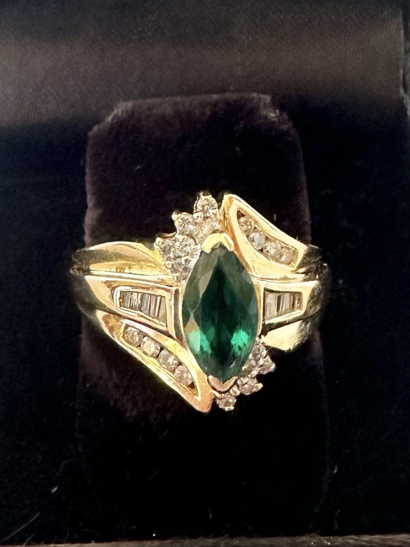 14K Yellow Gold Diamond and Synthetic Emerald Ring Size 7.25: 14K Yellow Gold Diamond and Synthetic Emerald Ring Size 7.25 This exquisite ring features a stunning marquise-shaped synthetic emerald centerpiece, elegantly framed by sparkling diamonds. Crafted from