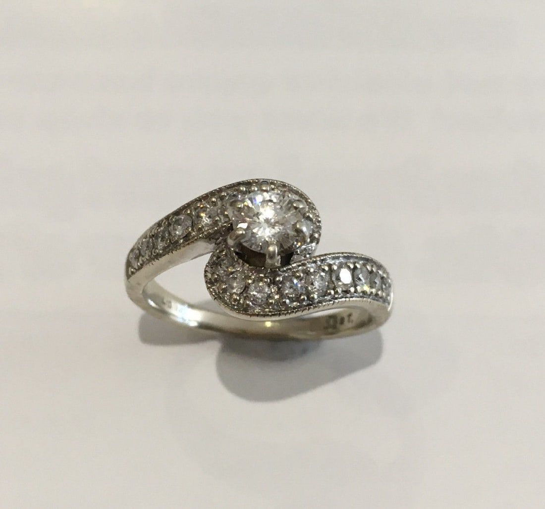 EGL Certified 14K White Gold Juliette Diamond Ring Size 6.25: EGL Certified 14K White Gold Juliette Diamond Ring Size 6.25 This elegant 14K white gold ring features a center round Juliette cut diamond weighing 0.31 carats with I color and SI1 clarity. The ring i