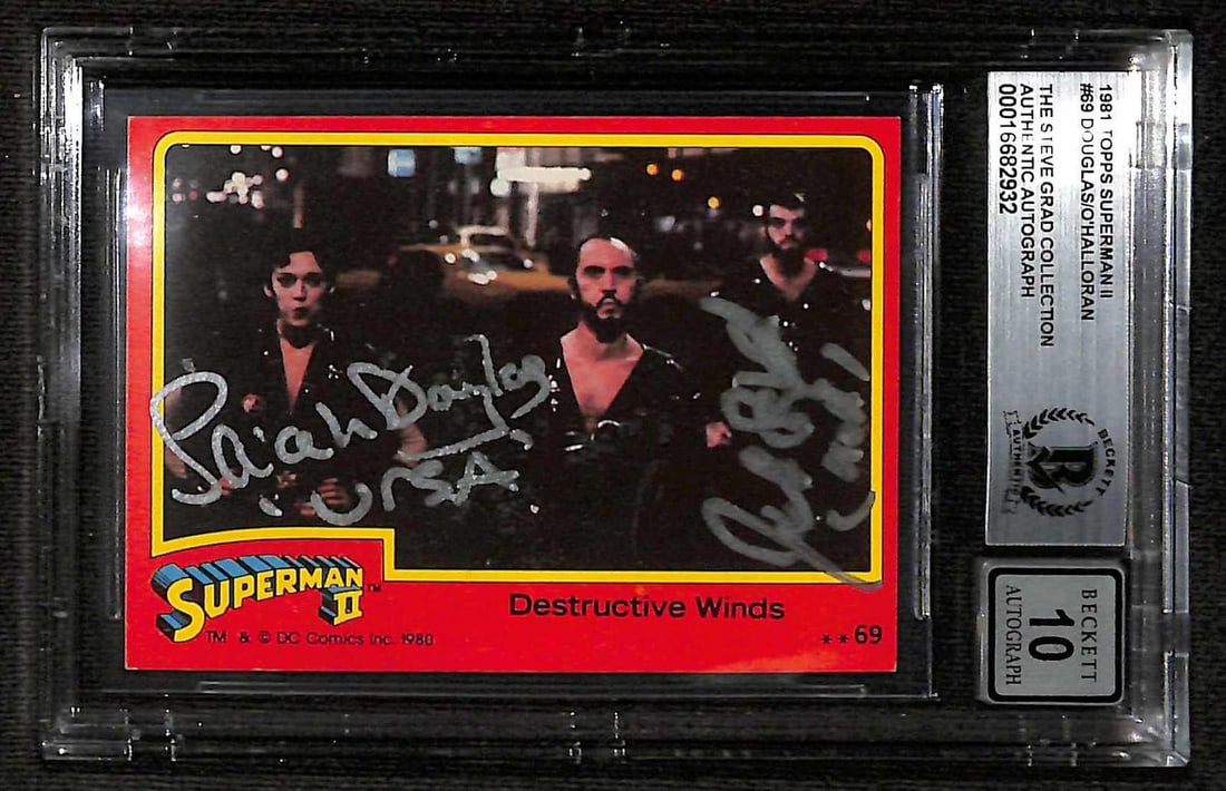 1981 Topps Superman II Destructive Winds card signed by Sarah Douglas and Jack O'Halloran BAS 10: 1981 Topps Superman II Destructive Winds card signed by Sarah Douglas and Jack O'Halloran BAS 10 This is a signed 1981 Topps Superman II "Destructive Winds" trading card, featuring signatures from Sar