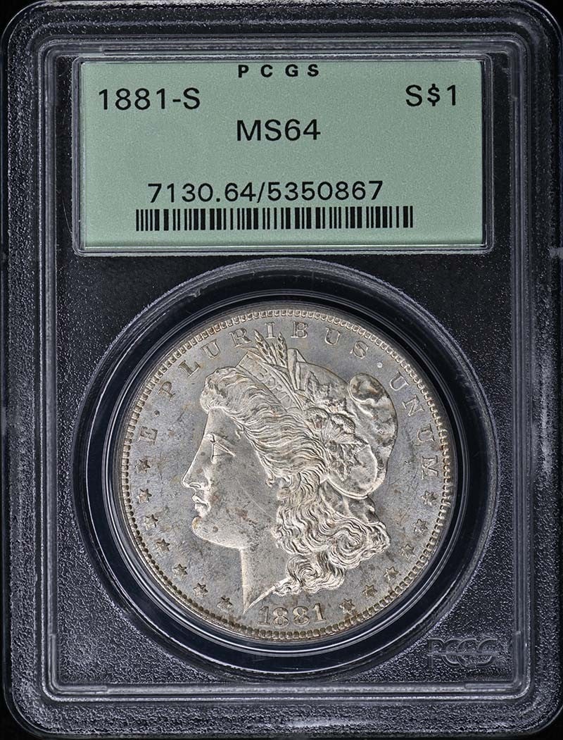 PCGS MS64 1881-S Morgan Silver Dollar OGH: PCGS MS64 1881-S Morgan Silver Dollar OGH This is an 1881 Morgan Dollar from the San Francisco Mint, graded MS64 by PCGS and housed in an Old Green Holder (OGH). The coin is uncirculated and features 