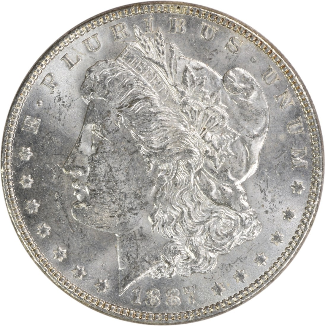Brilliant Uncirculated 1887 Morgan Silver Dollar Uncertified No Mint Mark: Brilliant Uncirculated 1887 Morgan Silver Dollar Uncertified No Mint Mark This is an uncirculated 1887 Morgan Silver Dollar from the United States. The coin is composed of silver, has no mint mark, an