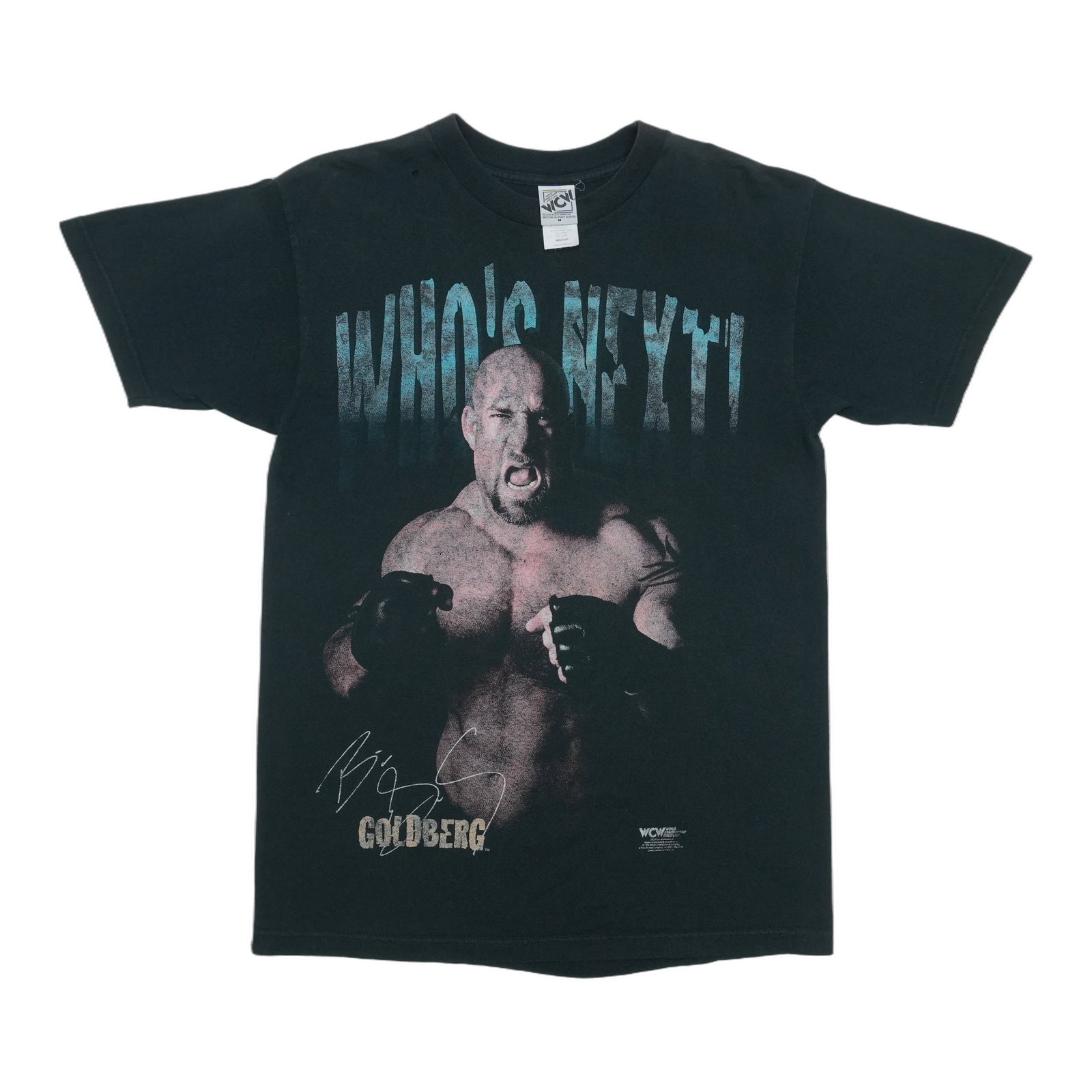Vintage 1998 Black Cotton Goldberg WCW Medium Shirt: Vintage 1998 Black Cotton Goldberg WCW Medium Shirt This is an original vintage 1998 Goldberg "Who's Next" WCW shirt featuring a front graphic. It is made from 100% cotton and comes in black. The shir