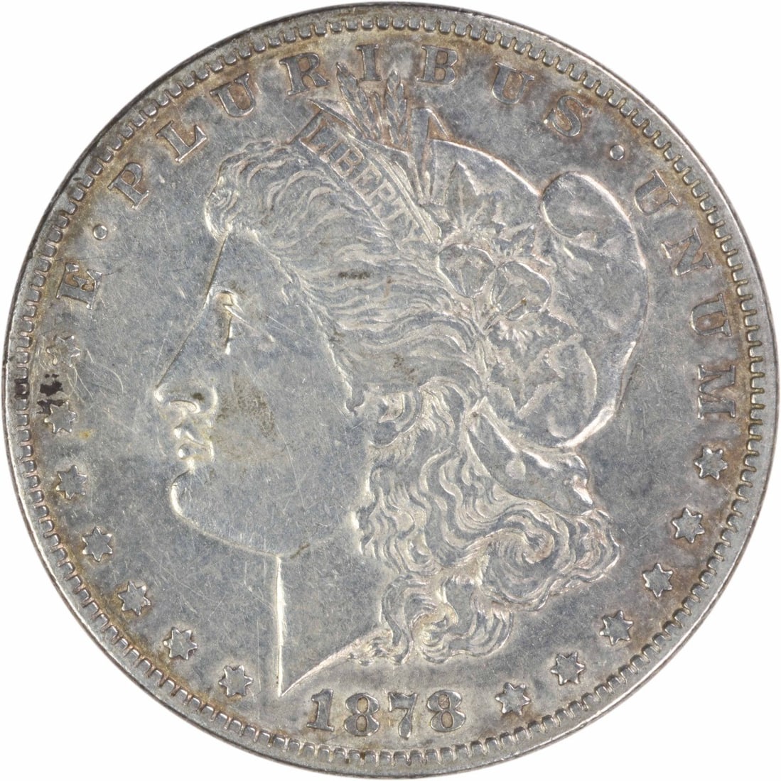 1878 Morgan Dollar Philadelphia 90 Silver 7 Over 8 Tail Feathers EF: 1878 Morgan Dollar Philadelphia 90 Silver 7 Over 8 Tail Feathers EF This is a pre-owned 1878 Morgan Silver Dollar from the Philadelphia Mint, featuring a 7/8 Tail Feathers variety. The coin is compose