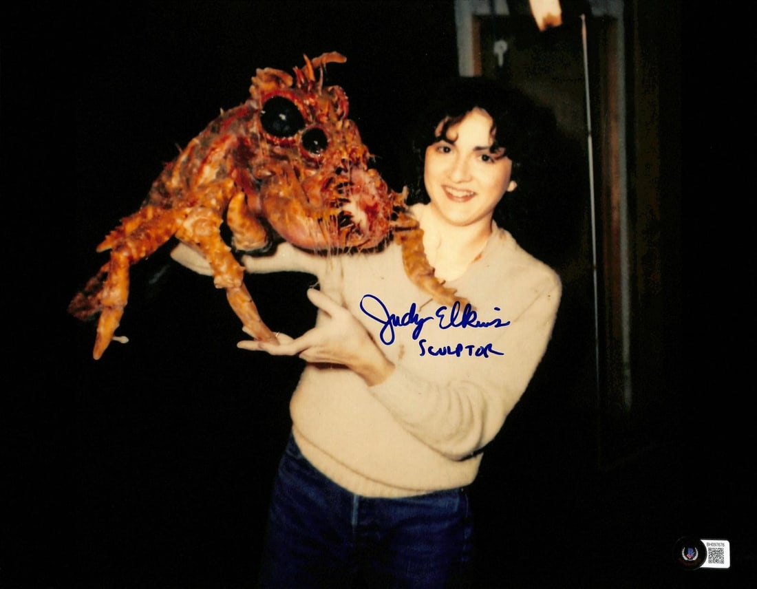Beckett Authenticated 11x14 Star Wars ROTJ Judy Elkins Signed Photo: Beckett Authenticated 11x14 Star Wars ROTJ Judy Elkins Signed Photo This 11x14 photograph features Judy Elkins, the acclaimed sculptor from Industrial Light & Magic, holding one of her creature creati