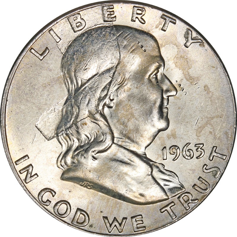 1963-P Franklin Half Dollar Struck Through Error Coin: 1963-P Franklin Half Dollar Struck Through Error Coin This 1963-P Franklin Half Dollar features a unique error known as 'Struck Through,' making it a fascinating addition to any collection. The coin i